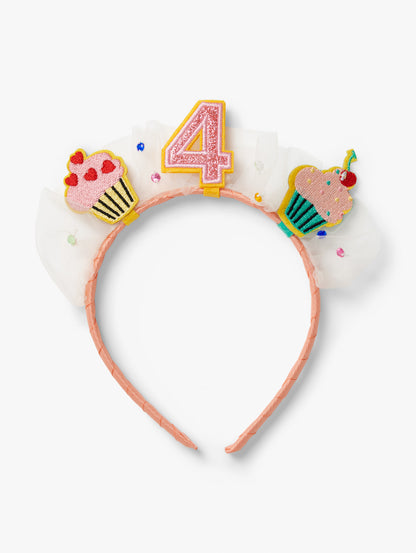 Stych Birthday Number Crown with central number 4, cupcake patches and tulle gem detail on a pink headband.