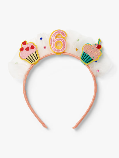 Stych Birthday Number Crown with central number 6, cupcake patches and tulle gem detail on a pink headband.