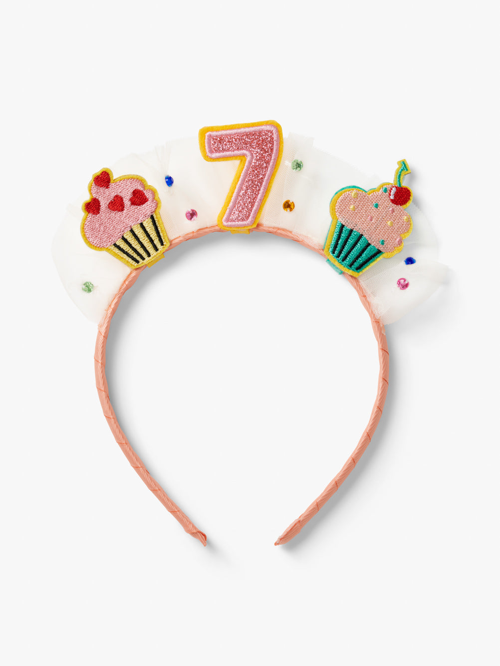Stych Birthday Number Crown with central number 7, cupcake patches and tulle gem detail on a pink headband.