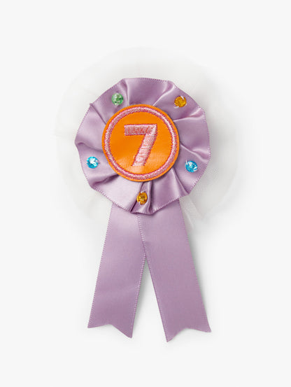 Stych Girls Birthday Number Lilac ribbon Rosette Pin Badge with decorative tulle and gems and a number 7 in the centre. 