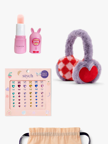 Stych Kids ski collection gift set, including a lip balm, face gems and lilac faux fur earmuffs, gifted in a gift set 
