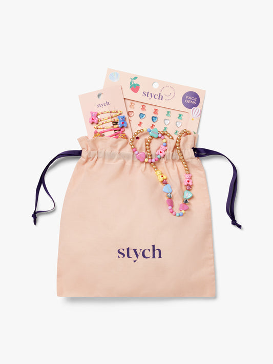 Stych Girls Colourful dress up gift includes 4 Pack Teddy & Cupcake shapes on click clack clips, Matching beaded & bracelet, Face Gem Pack packed  in a drawstring pink Stych bag 