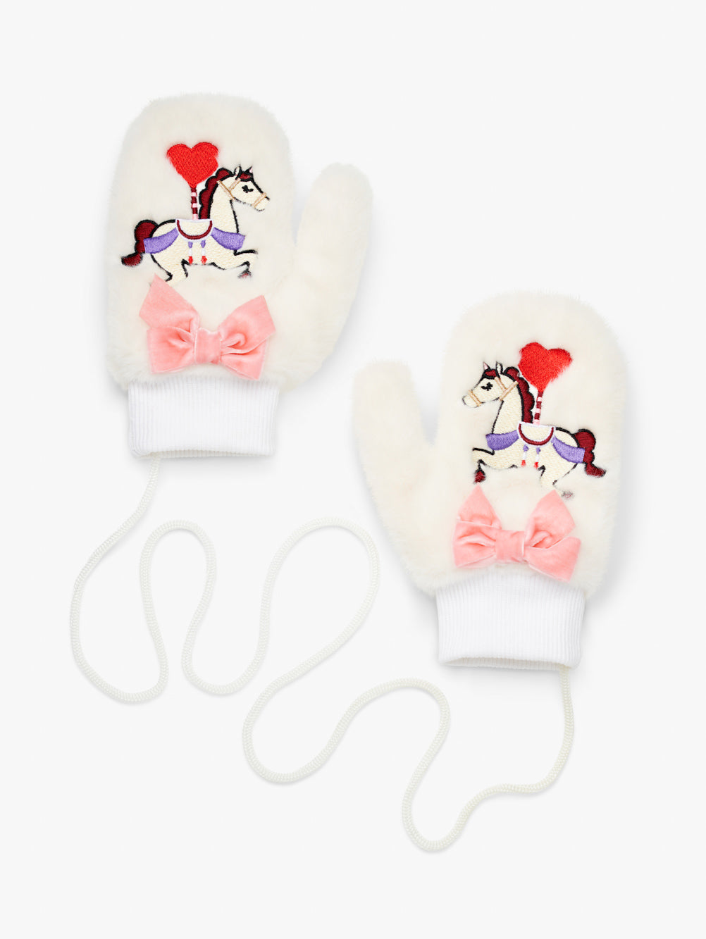 Stych Kids Pair of white faux fur mittens with embroidered unicorn patch detail and velour pink bow. Ribbed cuffs and string attachment. 
