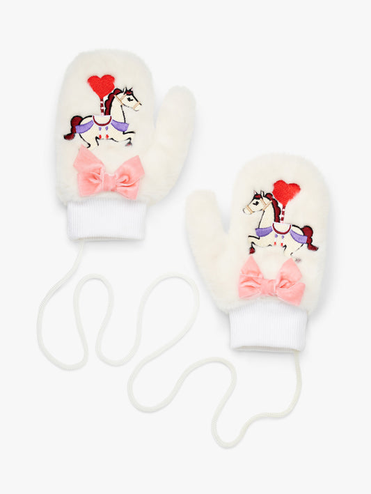 Stych Kids Pair of white faux fur mittens with embroidered unicorn patch detail and velour pink bow. Ribbed cuffs and string attachment. 